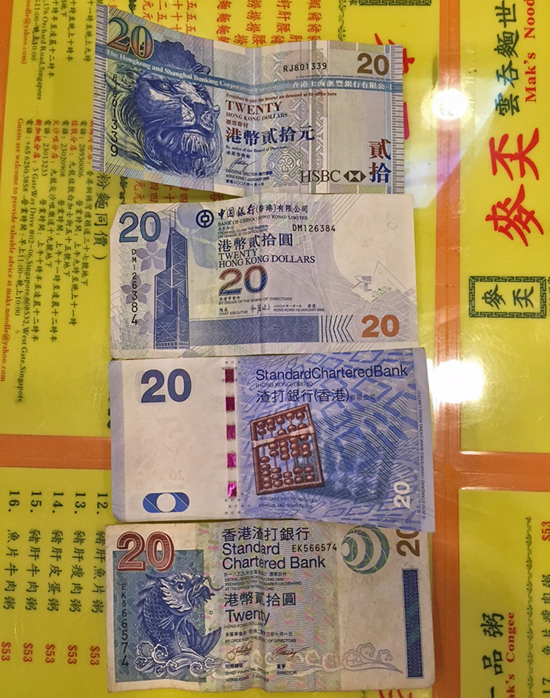 Hong Kong - Moeda local tem diferentes notas do mesmo valor